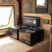 Renogy 3000W inverter and four Core Mini 300Ah batteries installed in a caravan storage locker with the hatch open