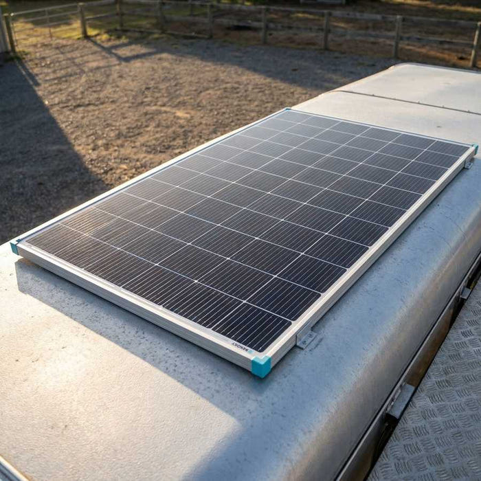 Renogy 16BB N-Type 200W solar panel mounted on a horse float roof beside a gravel yard