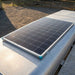 Renogy 16BB N-Type 200W solar panel mounted on a horse float roof beside a gravel yard