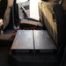 Two Renogy Super Slim 104Ah batteries fitted side by side in a dual-cab ute's underseat cavity