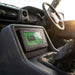 Renogy Bluetooth battery monitor mounted near the centre console showing charge, voltage and current