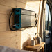 Renogy 2000W inverter mounted on a van conversion wall above a kitchen bench