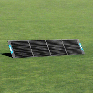 Renogy 200W portable solar panel folded out on grass.