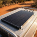 Renogy 200W ShadowFlux solar panel flat-mounted on a 4WD canopy roof rack with Z-brackets