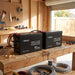 Two Renogy Core Mini 200Ah batteries wired in parallel on a shed workbench