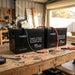 Two Renogy Core Mini 300Ah batteries wired in parallel on a shed workbench