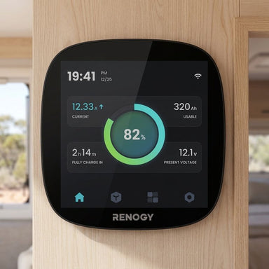Renogy ONE Core flush mounted in a caravan wall showing 82 percent state of charge on the 4 inch screen