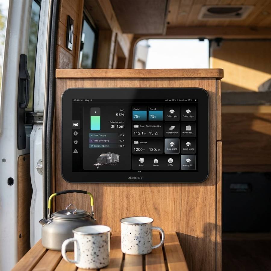 ONE Vision 7 mounted above the bench in a van conversion with a kettle and enamel mugs below