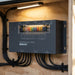 PMS1280 installed in a motorhome electrical bay with cable secured by black P-clips under LED worklight