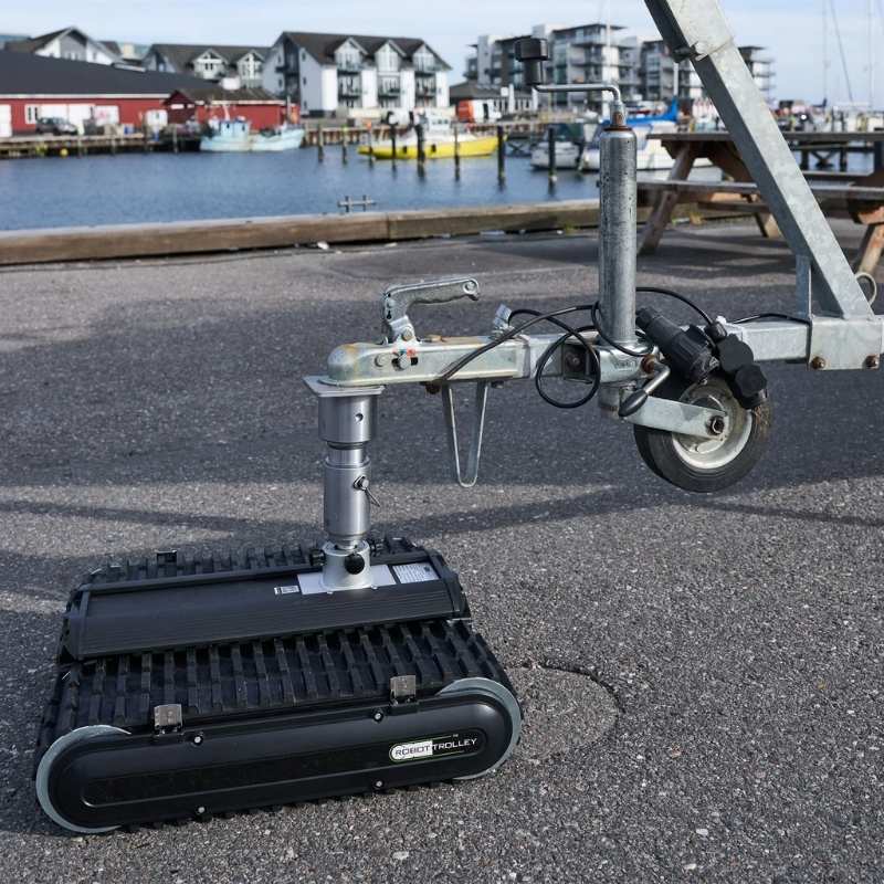 Robot Trolley 4500 G3 Caravan Mover supporting trailers at a marina with remote control use.