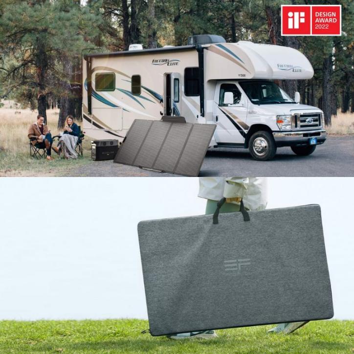 Couple sitting outside motorhome with panel beside the