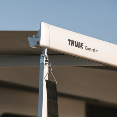 Close-up of Thule hold down side strap attached to Thule Omnistor awning support arm