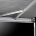 The Thule Omnistor 5200 Electric 12V awning extended during the evening, providing shade and lighting for the campsite.