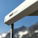 Close-up view of the Thule Omnistor 5200 Electric 12V awning cassette mounted on a vehicle with a clear sky in the background.