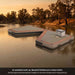 Launch 4 Grain floating on a calm river at golden hour, rubber bumper along the V, esky and rope on the non-slip pad. AI-assisted mock-up
