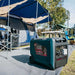 Welling & Crossley 6000W generator powering a full camping setup under a large tent